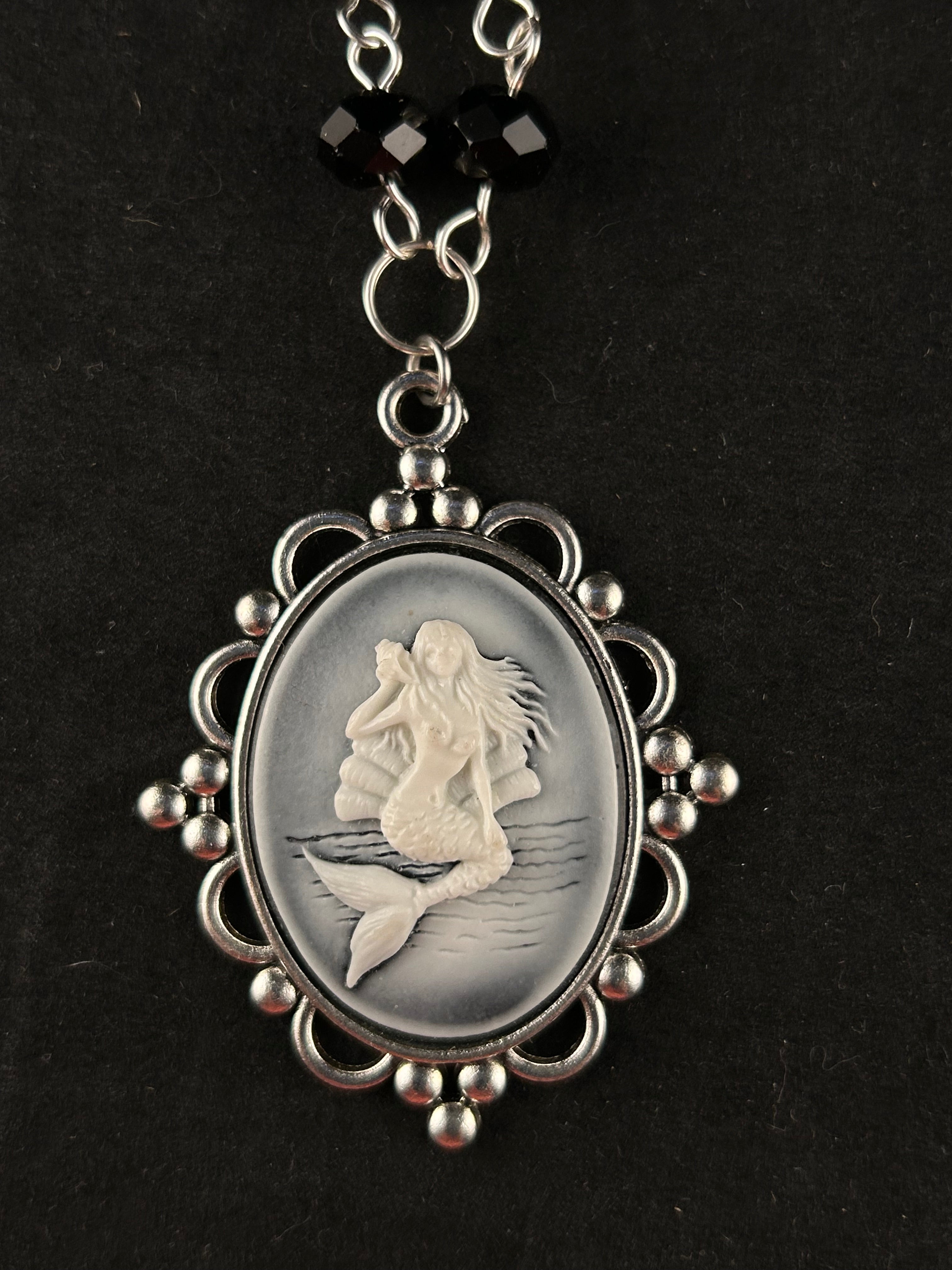 Siren (white, black, and silver)