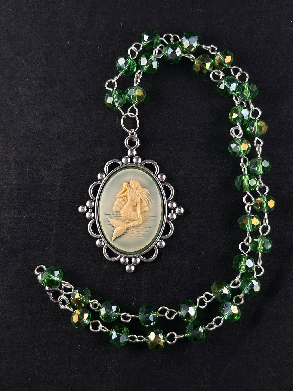 Siren (beige, sea green, and silver)”