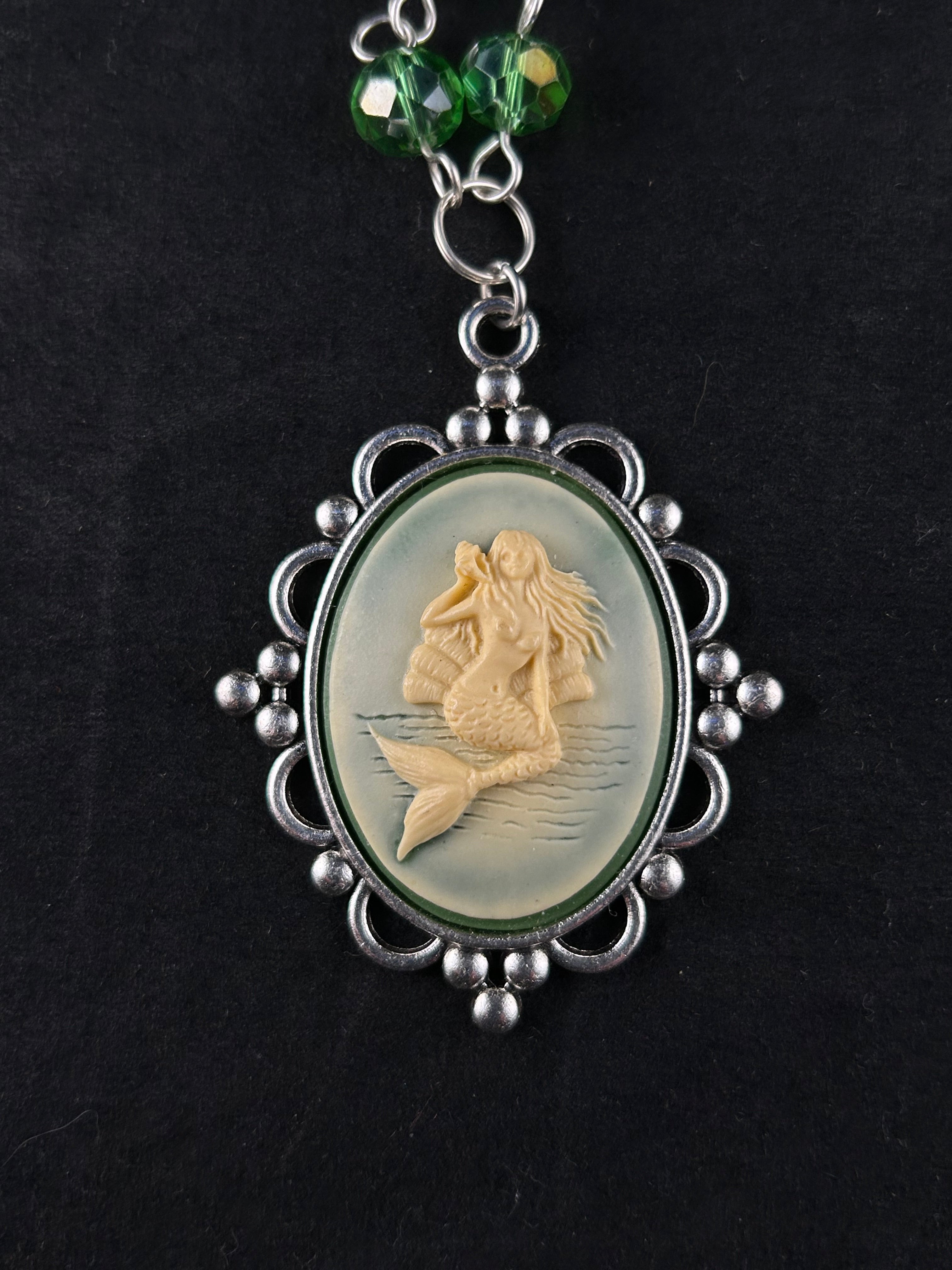 Siren (beige, sea green, and silver)”